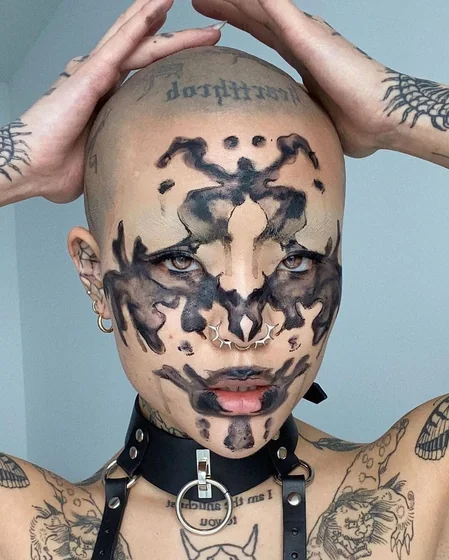 Abstract Blackwork Rorschach face tattoo idea for men, women on shoulder tattoo ideas.