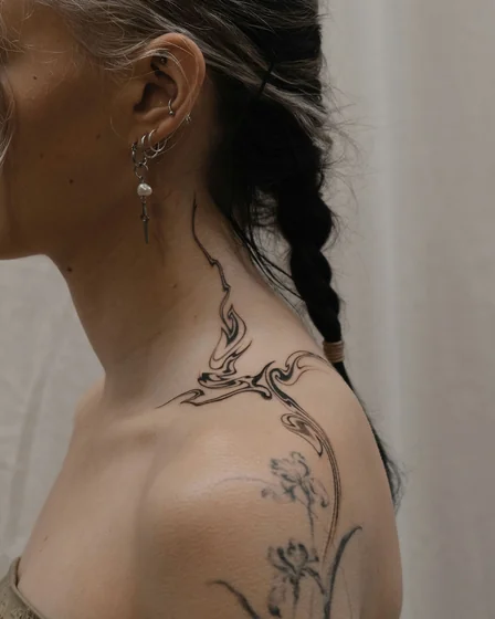 Abstract swirls and floral patchwork tattoo idea for women on neck, shoulder