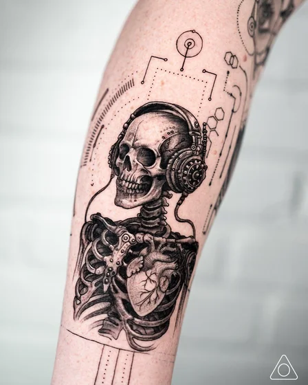 Biomechanical skull with headphones tattoo for men and women.