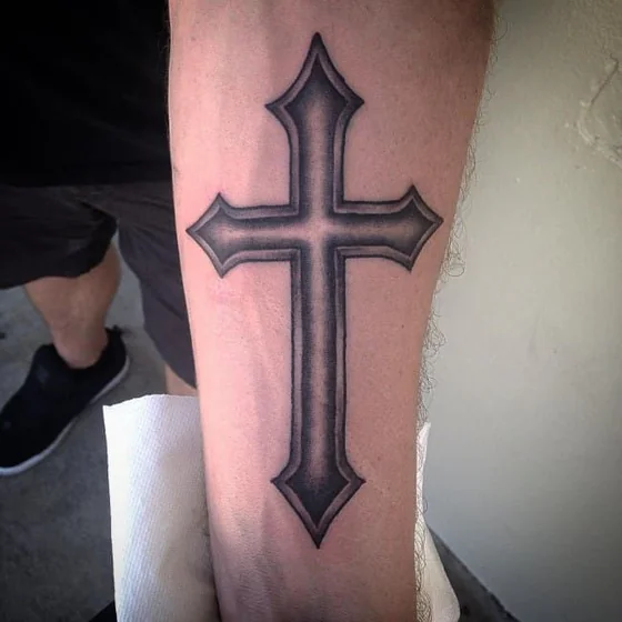 Black And Grey Cross tattoo design for men on forearm