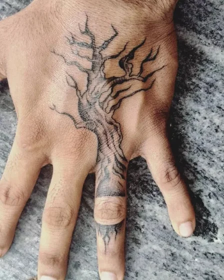 Black And Grey Linework tree tattoo design for men on hand and finger