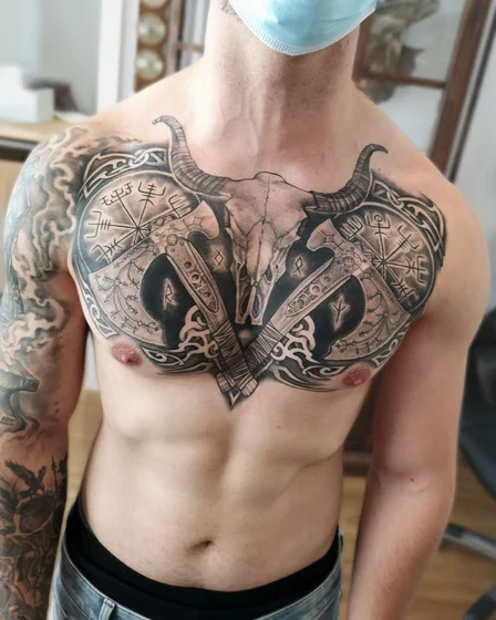 Black And Grey Viking skull, axes, runes tattoo design for men on chest
