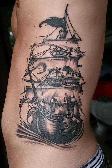Black And Grey pirate ship with mermaid tattoo design for men on rib.