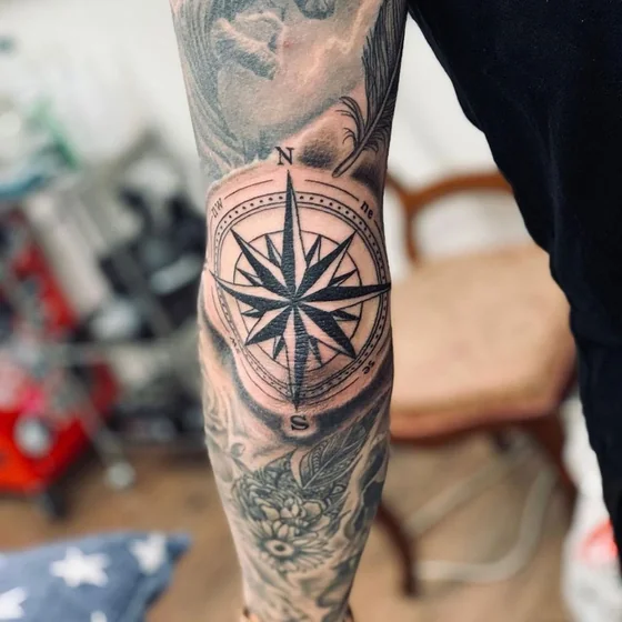 Black & Grey Realism compass, floral tattoo for men on arm