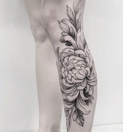 Black and Grey Fine Line flower tattoo design for women on calf