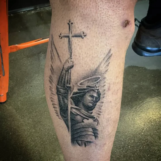 Black and Grey Realism Saint Michael Cross tattoo for men on calf