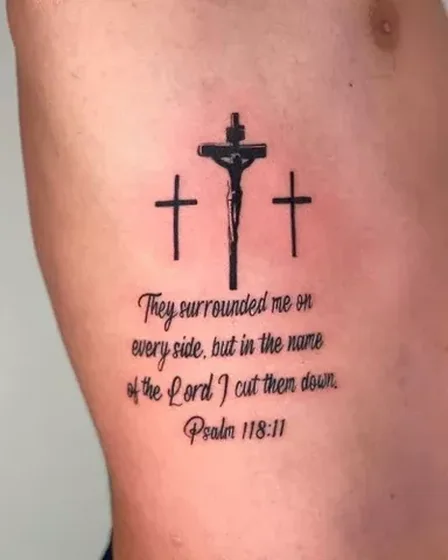 Black and Grey Script Cross and Jesus tattoo design for men on rib
