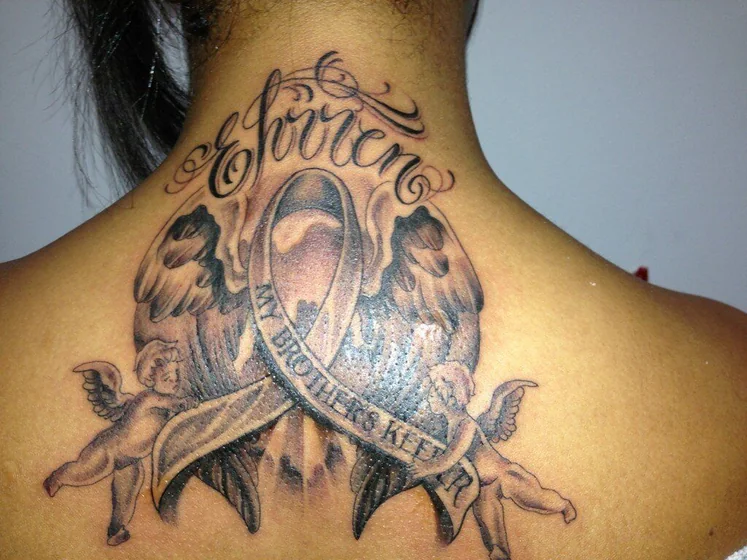 Black and grey angel and script tattoo for women on neck and back.
