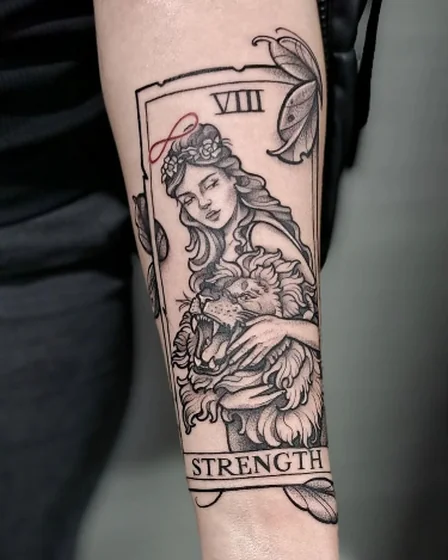 Black and grey dotwork Lion & Goddess tarot card tattoo for women on forearm