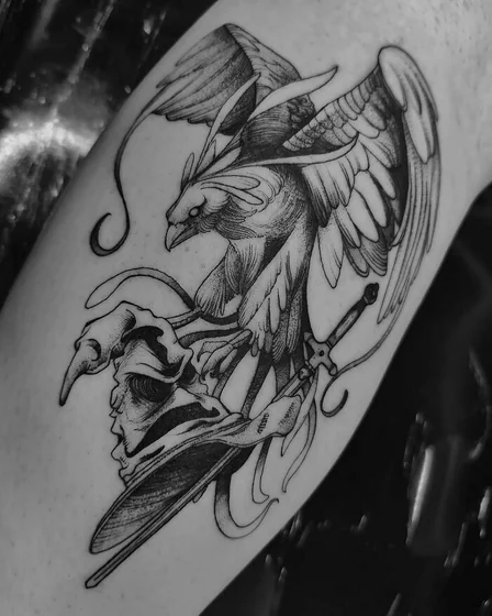 Black and grey fine line Griffin, skull, sword tattoo design for men and women on upper arm