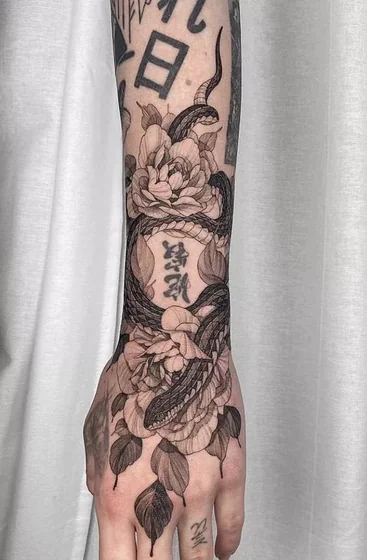 Black and grey fine line snake & floral Kanji tattoo for men/women on forearm