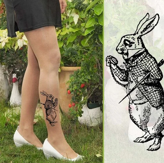 Blackwork Alice In Wonderland tattoo design for women on calf