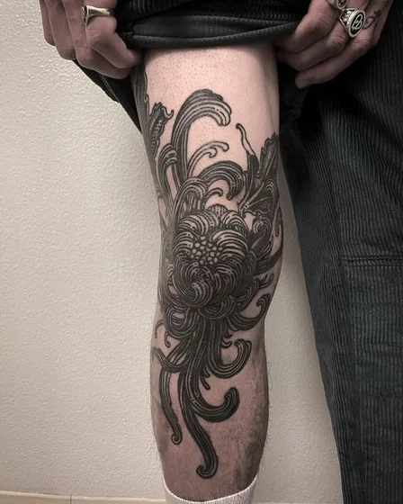 Blackwork Japanese flower tattoo design for men on leg and knee
