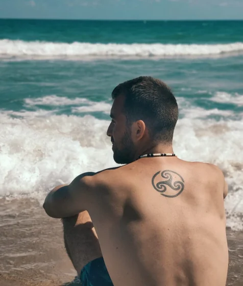 Blackwork Linework Triskelion tattoo for men on back