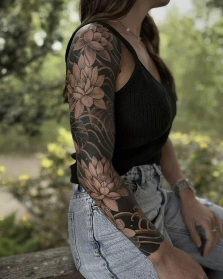 Blackwork Neo-Traditional lotus full sleeve tattoo idea for women
