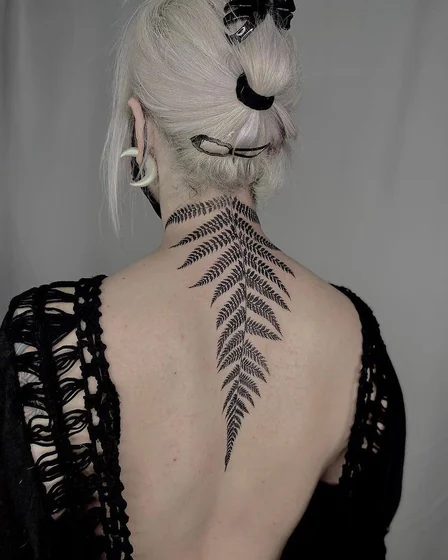 Blackwork and Fine Line floral tattoo design for women on neck and back