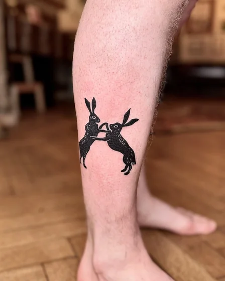 Blackwork and Woodcut hare tattoo design for men on calf
