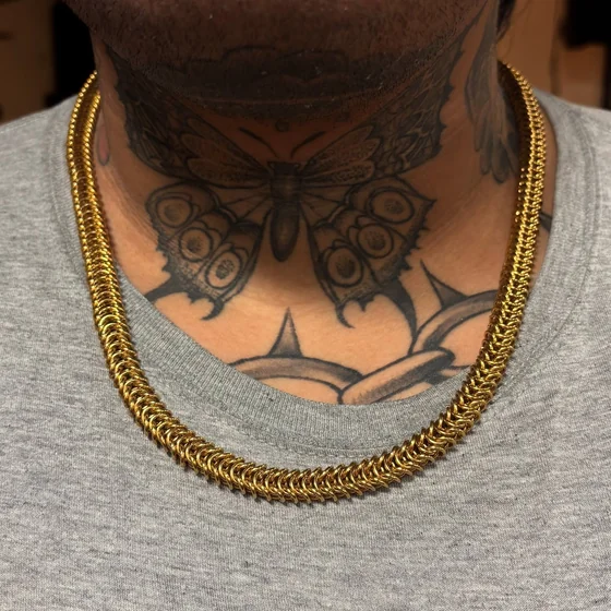 Blackwork butterfly and vine tattoo design for men on neck