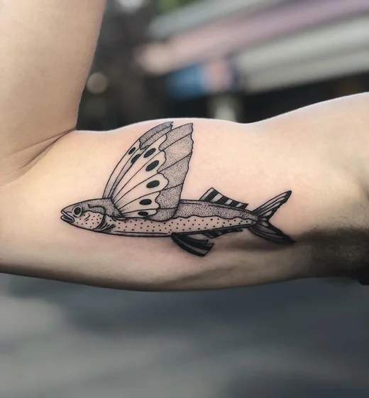 Blackwork dotwork fish and butterfly tattoo design for men on bicep