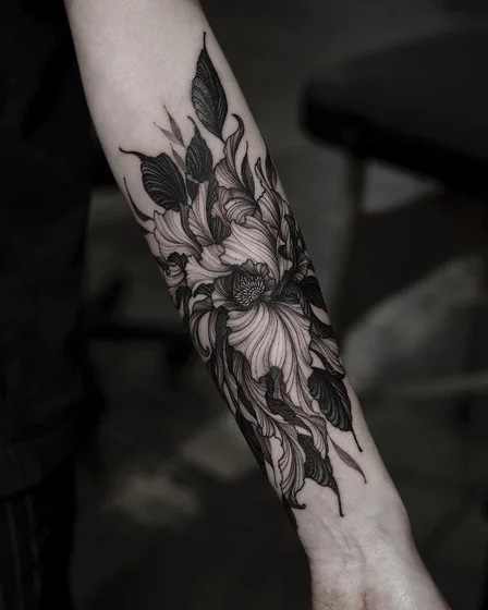 Blackwork fine line floral flower tattoo design for women on forearm and wrist