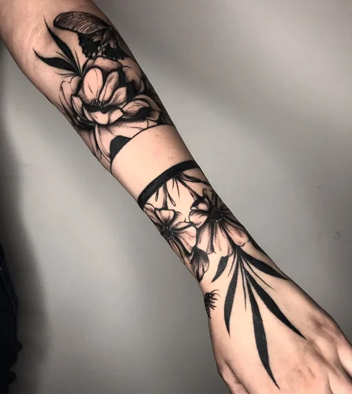Blackwork realism floral butterfly tattoo design for women on forearm