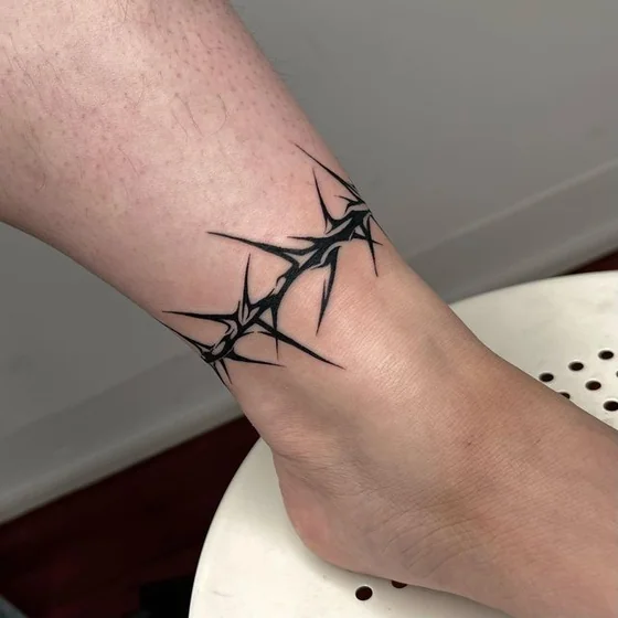 Blackwork thorns tattoo idea for men and women on ankle