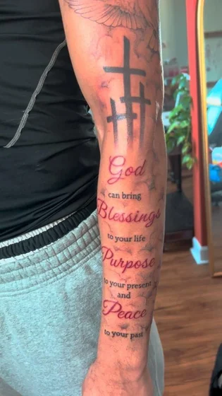 Christian Cross, Dove, and Script Quote tattoo design for men on forearm