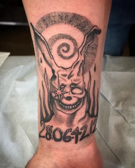 Dotwork Blackwork rabbit mask tattoo design for men on forearm