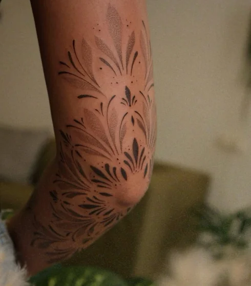 Dotwork and Fine Line floral tattoo design for women on elbow and upper arm