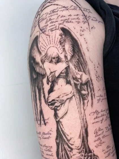Dotwork angel and quote tattoo for women on upper arm.