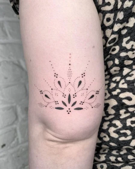 Dotwork floral mandala tattoo design for women on upper arm