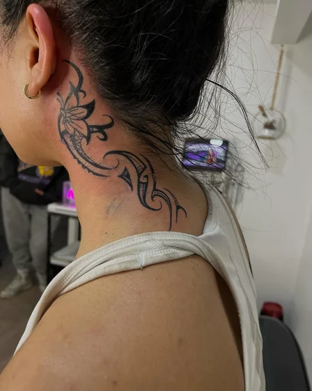 Feminine Tribal Blackwork floral tattoo design on neck and behind the ear