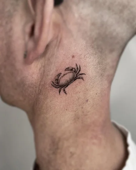 Fine Line Black And Grey Crab tattoo design for men on neck/behind ear