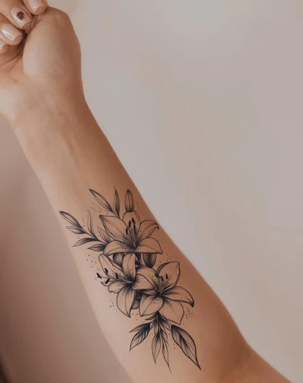 Fine Line Black And Grey Lily Floral tattoo idea for women on forearm