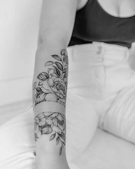 Fine Line Black And Grey floral arm band tattoo design for women on forearm