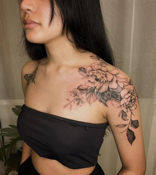 Fine Line Black And Grey floral butterfly tattoo for women on shoulder and upper arm