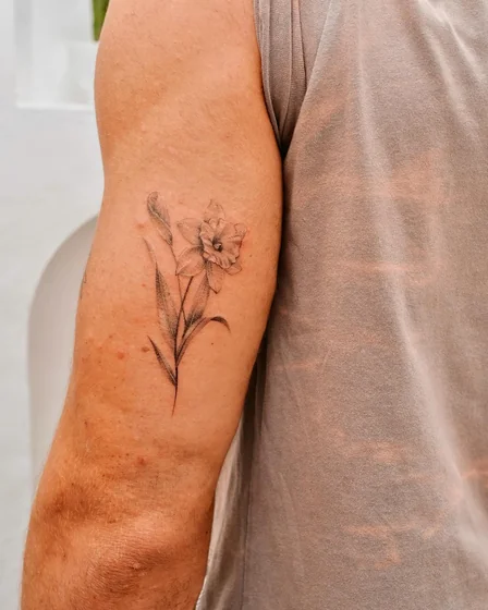 Fine Line Black And Grey floral tattoo design for men on upper arm