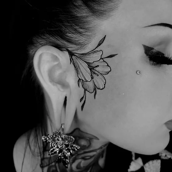 Fine Line Black And Grey floral tattoo design for women on face tattoo ideas