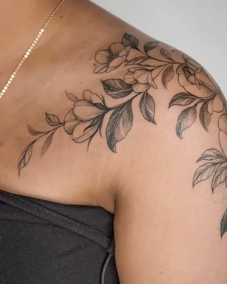 Fine Line Black And Grey floral tattoo design for women on shoulder and upper arm