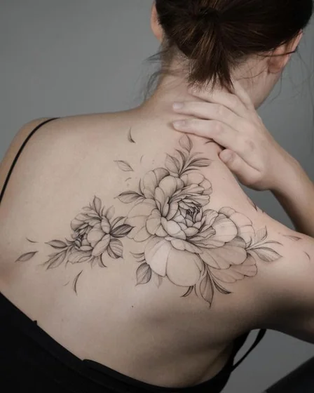 Fine Line Black And Grey floral tattoo for women on back shoulder
