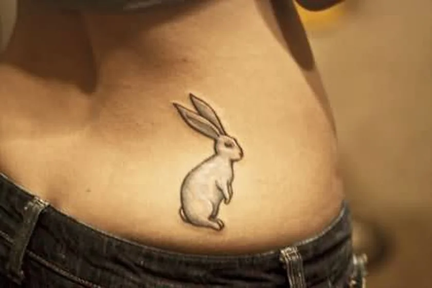 Fine Line Black And Grey rabbit tattoo idea for women on hip