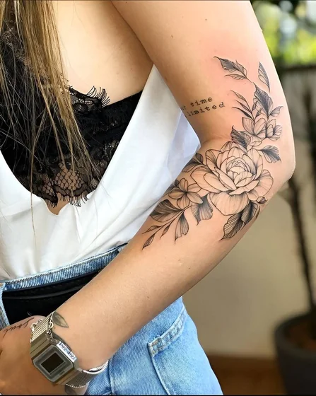 Fine Line Black And Grey rose and floral tattoo for ladies on upper arm