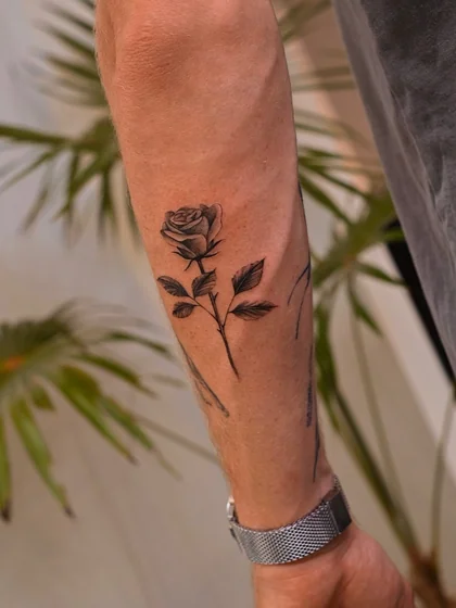 Fine Line Black And Grey rose tattoo idea for men on forearm