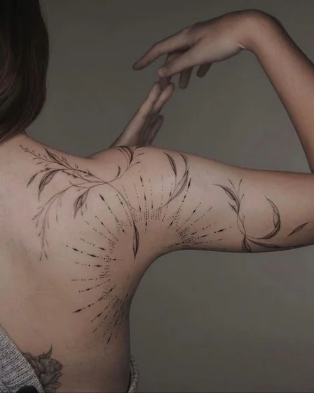 Fine Line Dotwork floral sun tattoo design for women on shoulder