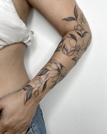 Fine Line Dotwork floral tattoo design for women on forearm and upper arm
