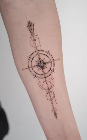 Fine Line Geometric Compass Feather tattoo for women on forearm