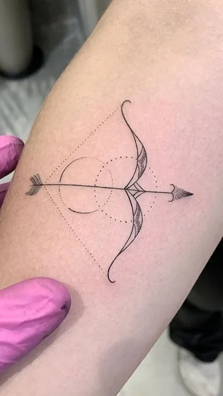 Fine Line Geometric Sagittarius arrow tattoo design for women on forearm