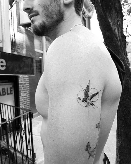 Fine Line Geometric bird and Anchor tattoo design for men on upper arm