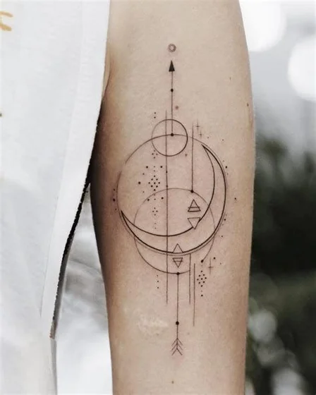 Fine Line Geometric moon, star, arrow tattoo design for women on upper arm