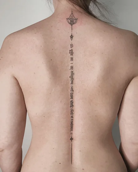 Fine Line Lotus and Script tattoo design for women on Back and Neck